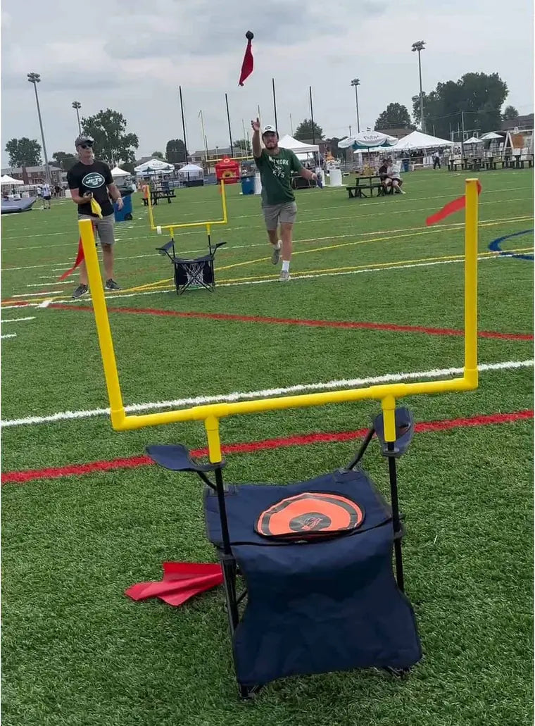QB54 goal posts and a REF54 target chair set up together at a tailgate